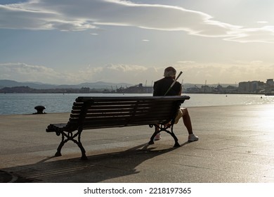 Backlit Man Looking At The Port Of Santander