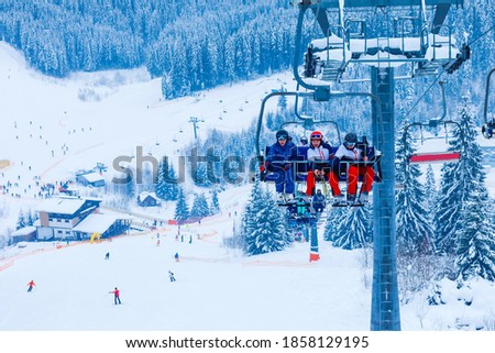backlit scenes with ski lift chairs on hillside, Levi ski resort, Finland