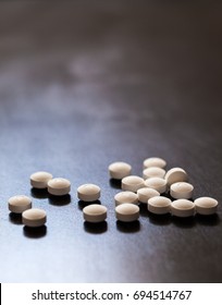 Backlit White Pills - Opioid And Prescription Medication Addiction Epidemic Or Crisis - Concept