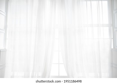 Backlit window with white curtains in empty room - Shutterstock ID 1951186498