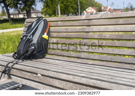 Backpack left on the bench, Concept, suspicious luggage, lost items