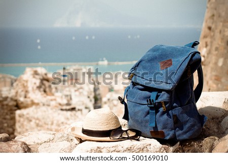 Backpack in the mountin with the hat. Depth of field, selective focus