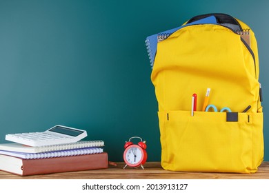 Backpack on the desk in the classroom. - Shutterstock ID 2013913127