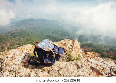 backpack on top of the mountain