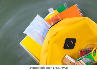 Backpack Prepared With School Supplies And Mask For The Return To School.