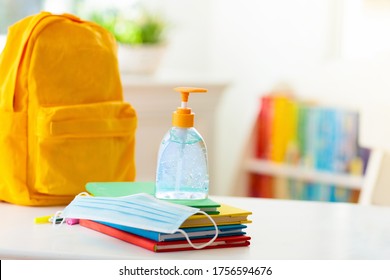 Backpack of school child with face mask and sanitizer. Student safety after coronavirus pandemic. Virus and disease prevention for kids. Back to school and kindergarten after covid-19 outbreak. - Powered by Shutterstock