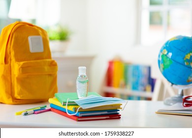 Backpack of school child with face mask and sanitizer. Student safety after coronavirus pandemic. Virus and disease prevention for kids. Back to school and kindergarten after covid-19 outbreak. - Powered by Shutterstock