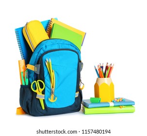 Backpack with school stationery on white background