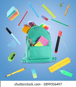 Backpack surrounded by flying school stationery on light blue background - Shutterstock ID 1899356497