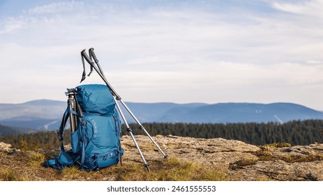 Backpack with tripod and hiking pole during trekking in mountains. Outdoor equipment for hike and trekking activity - Powered by Shutterstock