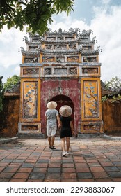 Backpacker couple enjoy trip through southeast Asia in imperial city of Hue, Vietnam