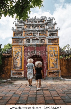 Backpacker couple enjoy trip through southeast Asia in imperial city of Hue, Vietnam