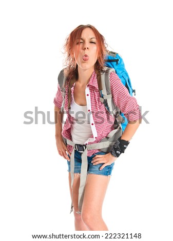 backpacker doing a joke over isolated white background