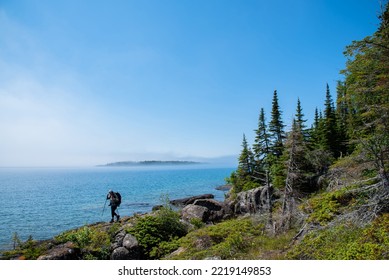 Backpacker hikes across ridge on Isle Royale National Park