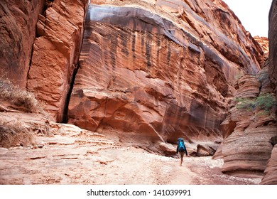 A Backpacker Hikes Through Buckskin Gulch In Southern Utah