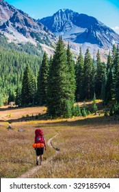 Backpacker Hiking CONUNDRUM CREEK TRAIL Near Aspen Colorado