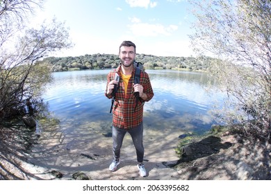Backpacker with lake in the background