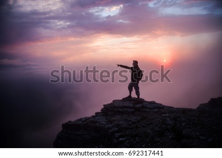 Similar – photographer in mountain at sunset