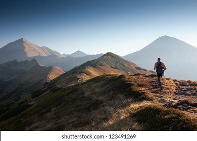 Backpacker at Ornak Peak in Tatra Mountains, Poland - Powered by Shutterstock