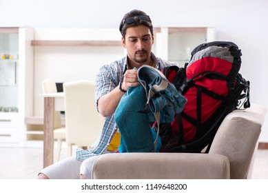 Backpacker Packing For His Trip