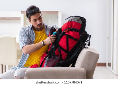 Backpacker Packing For His Trip