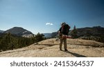 Backpacker Pauses To Take A Photo In The Yosemite Backcountry