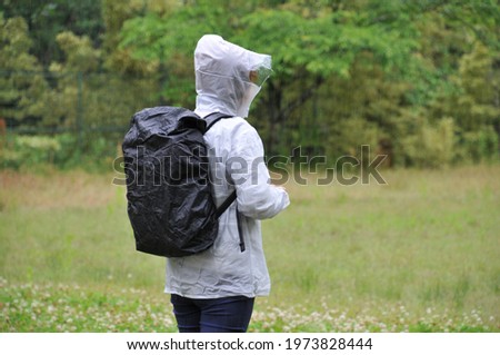 backpacker standing in the rainyday