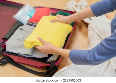 Backpacker travel of journey, asian young woman, packing or prepare clothes into luggage, traveler case for journey trip, note and check list for holiday vacation at home. Voyage of traveler people.