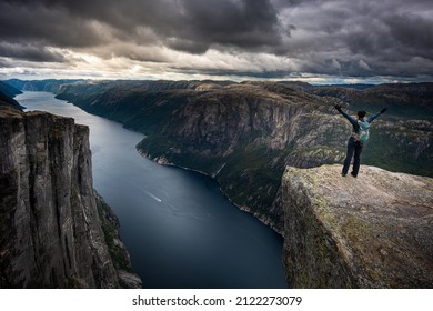 Backpacker In Victory Pose, Eagle Head Viewpoint Near Kjeragbolten 