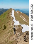 backpacker walking at the ridge of fellhorn mountain in the allgau alps, destination oberstdorf