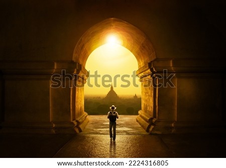 Backpacking tourist in a Bagan temple