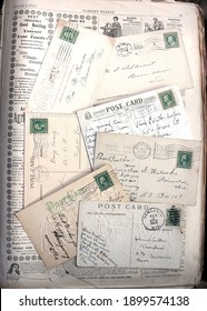 Backs Of Vintage Postcards, Early 1900s, On An 1872 Newspaper For Background. Postmarks And Stamps.