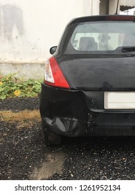 Backside Of Black Car Get Damaged By Accident.