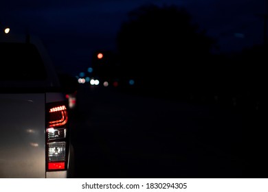 Backside Of Car Break On The Road At Night By Traffic Jam Or Stop By Light Control In Crossroad.