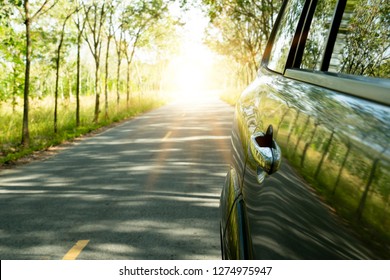 ฺBeside Of Backside Car On The Road Asphalt. Two Sides Are Full Of Rubber Trees. With Rushing From The Destination Of The Road. Trip Travel Nature Tourism.