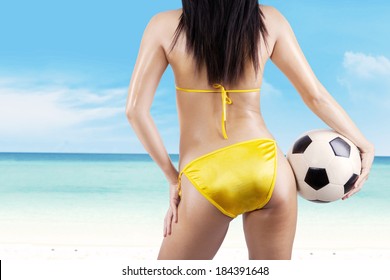 Backside Sexy Woman With A Soccer Ball At Beach