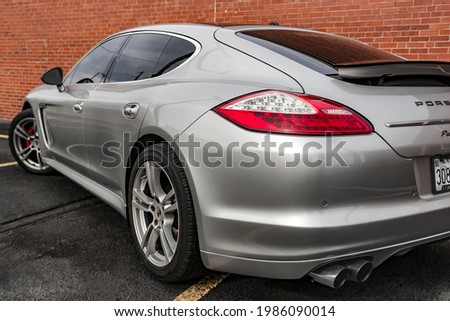 Backside of Silver Porsche Panamera