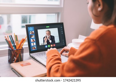 Backside View of Business Woman Talking Together on Online Meeting Video Conference Agenda with Coporate Colleagues Multiethnic Business People - Online Working from Home Concept
