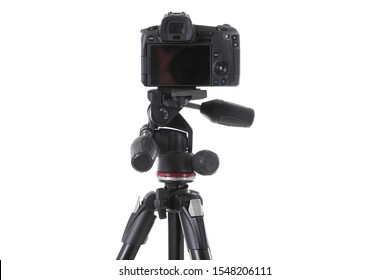 Backside view of modern multifunctional black camera on trepied isolated