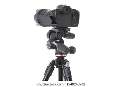 Backside view of modern multifunctional black camera on trepied isolated