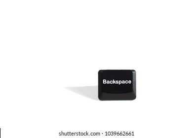 Backspace Button From A Black Keyboard On A White Background. The Concept Is To Take A Step Back, Fix The Situation. 