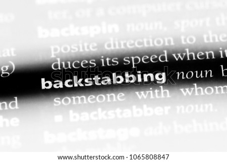 backstabbing word in a dictionary. backstabbing concept.
