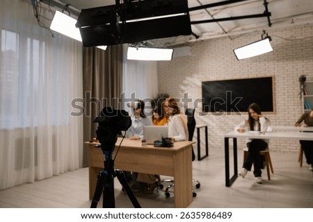 Backstage. Students in a classroom explore virtual reality, enhancing their educational experience through immersive technology.