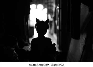 Backstage Theater; Silhouette Of A Child Actor In Cat Ears Handband 