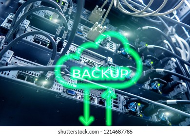 Backup button on modern server room background. Data loss prevention. System recovery.