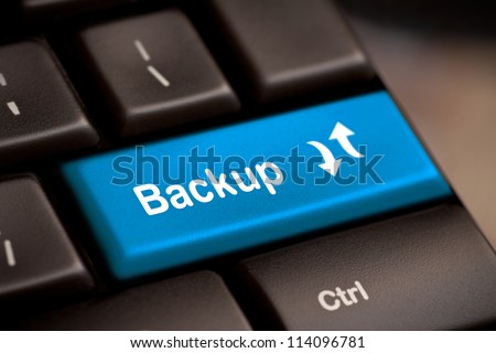 Backup Computer Key In Blue For Archiving And Storage