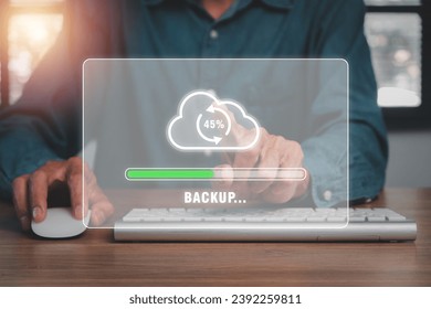 Backup concept, Business person hand touching backup icon on cirtual screen.
