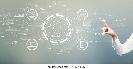 Backup concept with hand pressing a button on a gray background