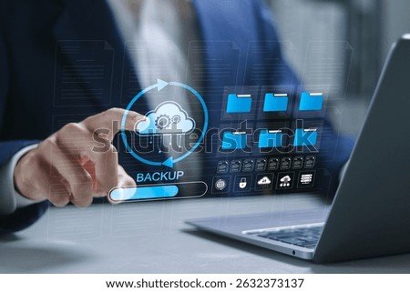 Backup concept, Online digital data storage and connection service. Businessman using laptop with backup icons for data backup management.