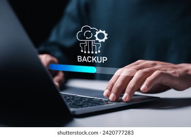 Backup concept, Person use laptop with virtual Backup status bar for data backup management. Online digital data storage and connection service.